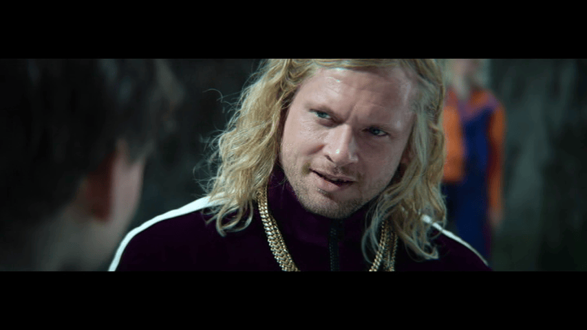 Close-up of Sir Lord Jimmy Crystal wearing the pendant from the previous image