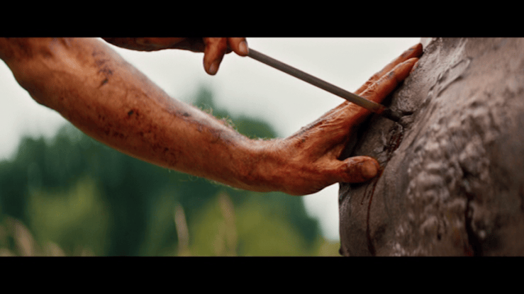 Close-up of Kelson removing an arrow from Samson's chest